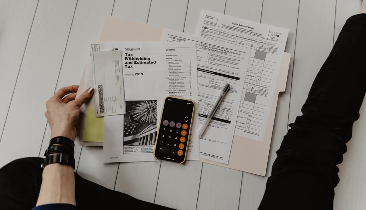 Financial planning documents and calculator on desk