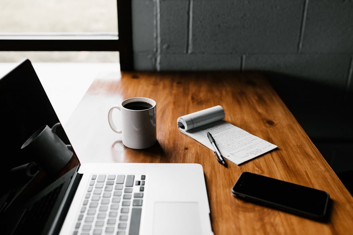 Peaceful workspace with laptop and coffee, representing effortless follow-ups