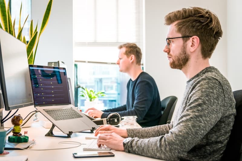 Modern workspace with task management on screen